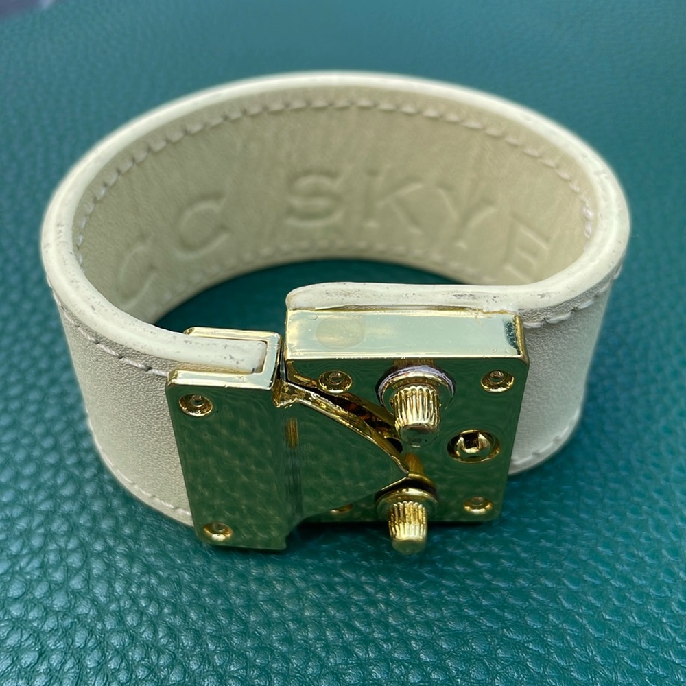 C.C. Skye leather and gold tone bracelet.